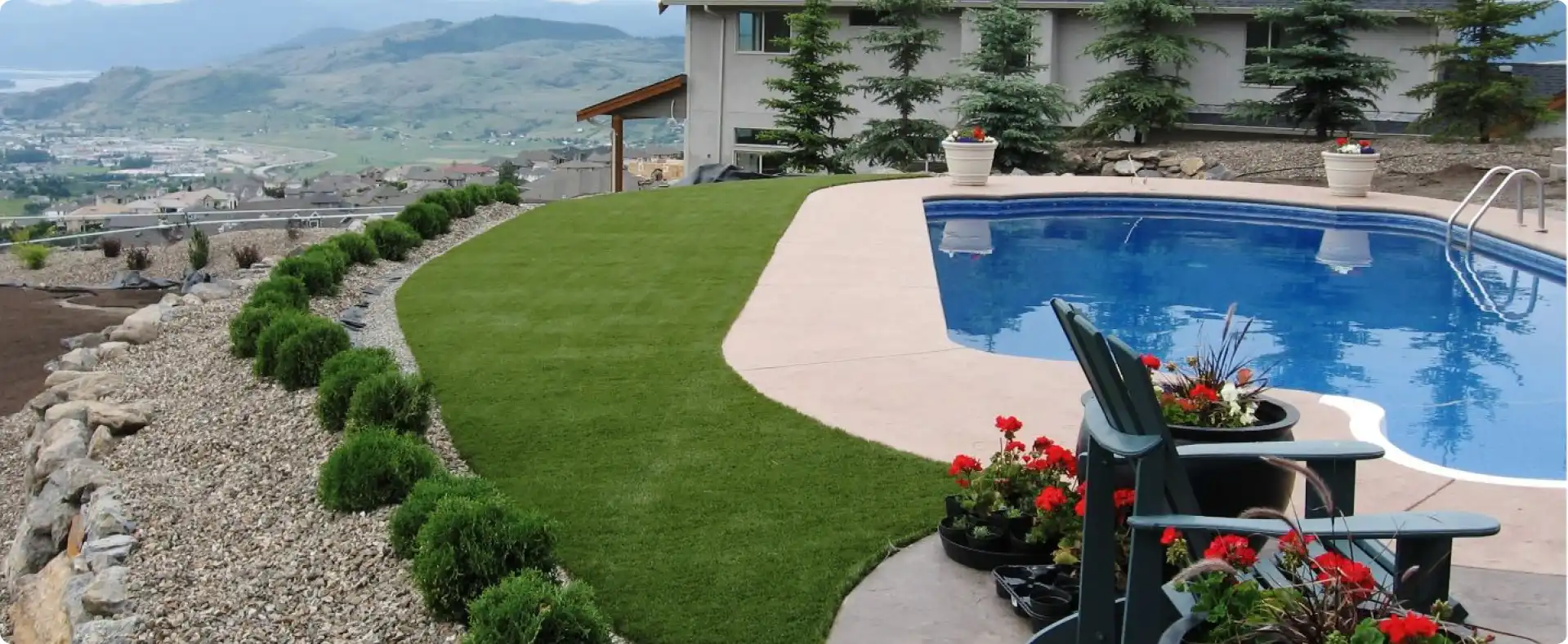 Residential outdoor synthetic lawn by pool