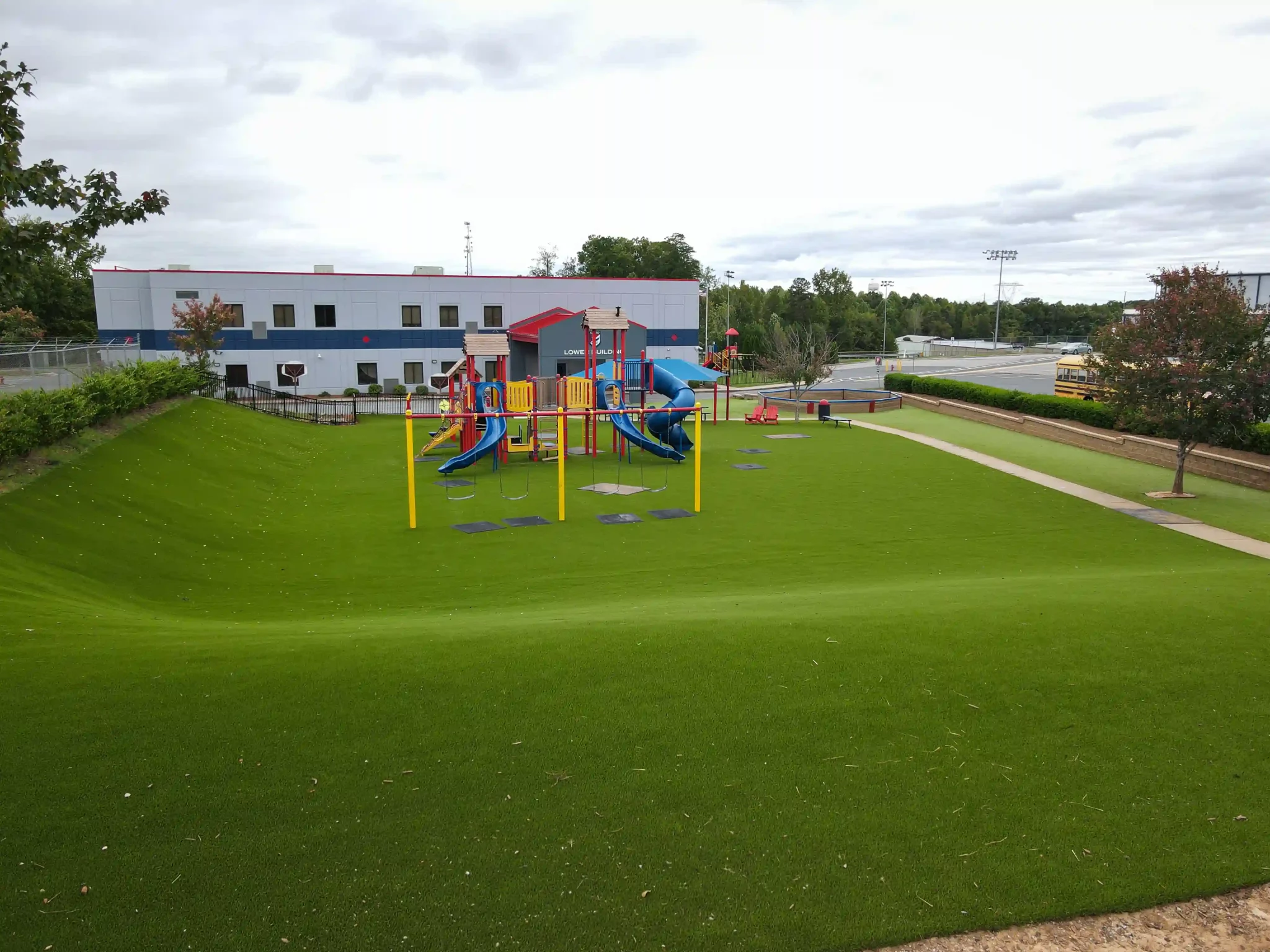 School playground on artificial grass lawn by New Hampshire Turf Store